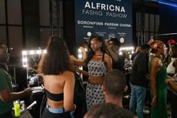 Models and dressers during backstage fittings before a show