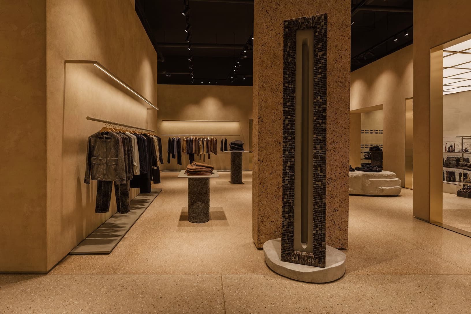 Clothing rails and displays inside a luxury concept store