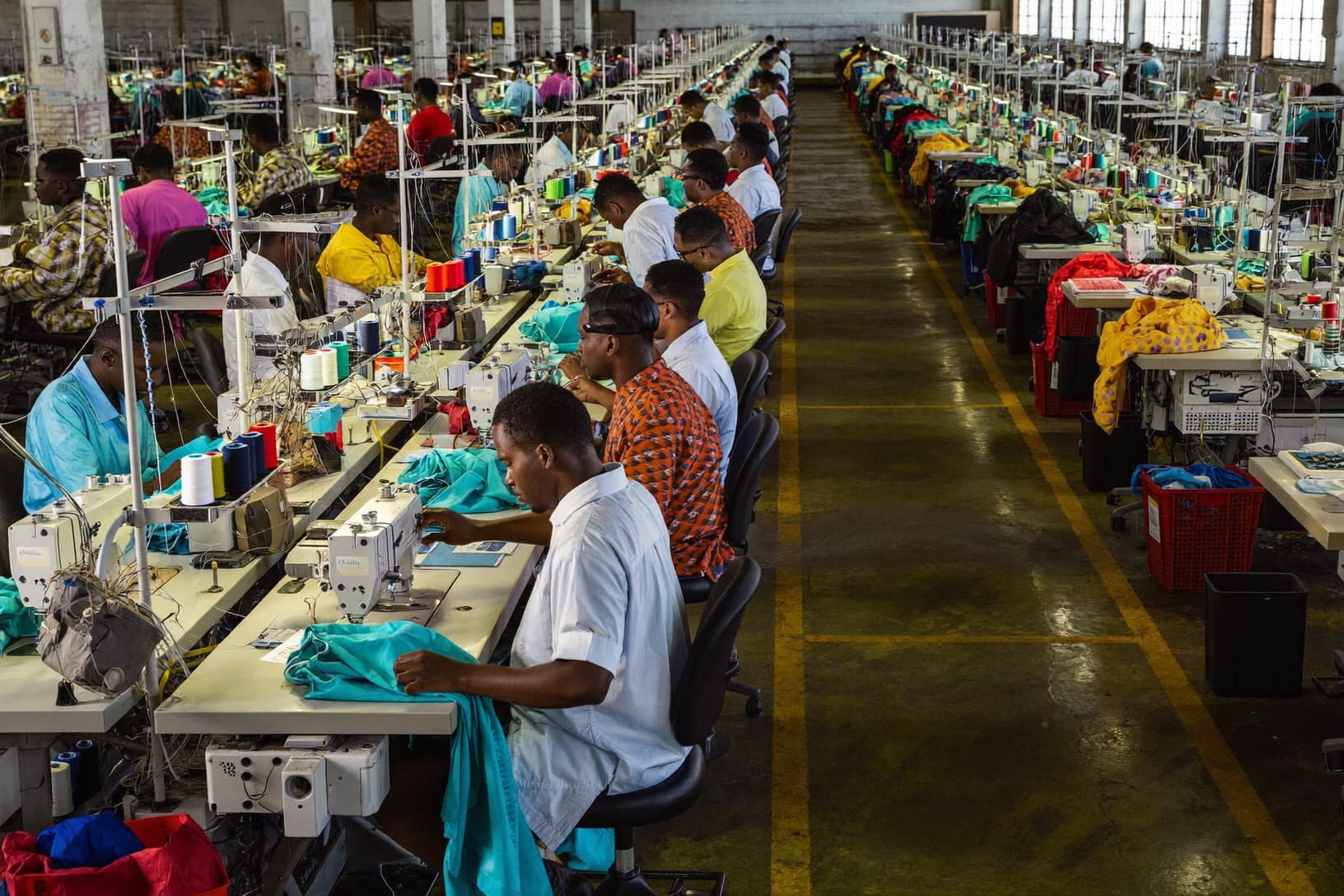 Rows of sewing stations on an apparel manufacturing floor